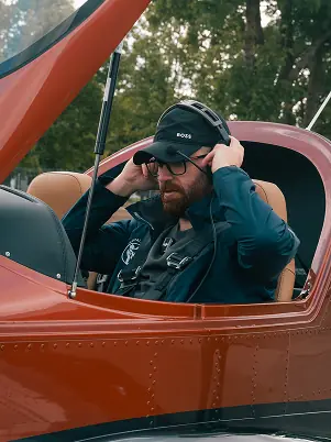 Pilot in cockpit with sunglasses